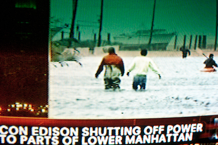 Men wade in street, lower Manhattan