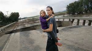 Woman, child, hole in road